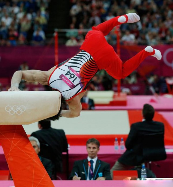 Japanese athletes Kohei Uchimura bouncing in action