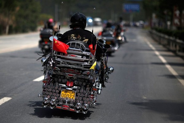Biker rides a Harley Davidson motorcycle during the annual rally 