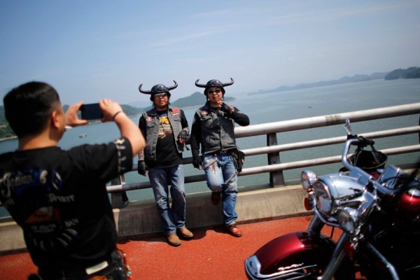 Bikers pose for photographers during the annual Harley Davidson rally 