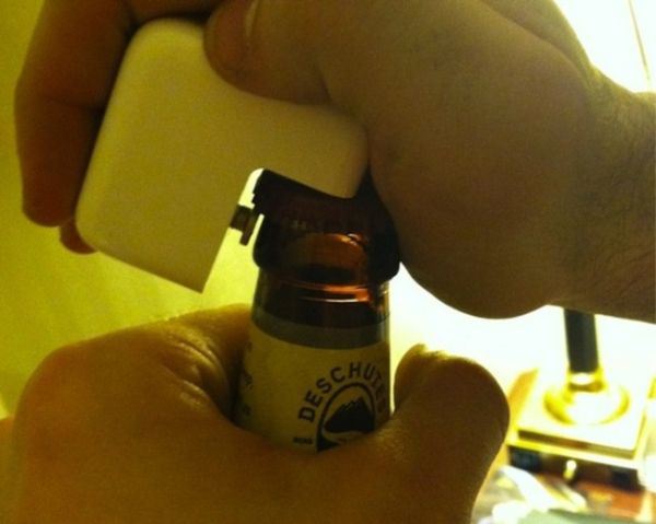 Take the plug end off of a macbook charger and use it as a bottle opener