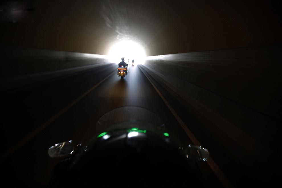 Bikers ride through the tunnel during the annual Harley Davidson rally