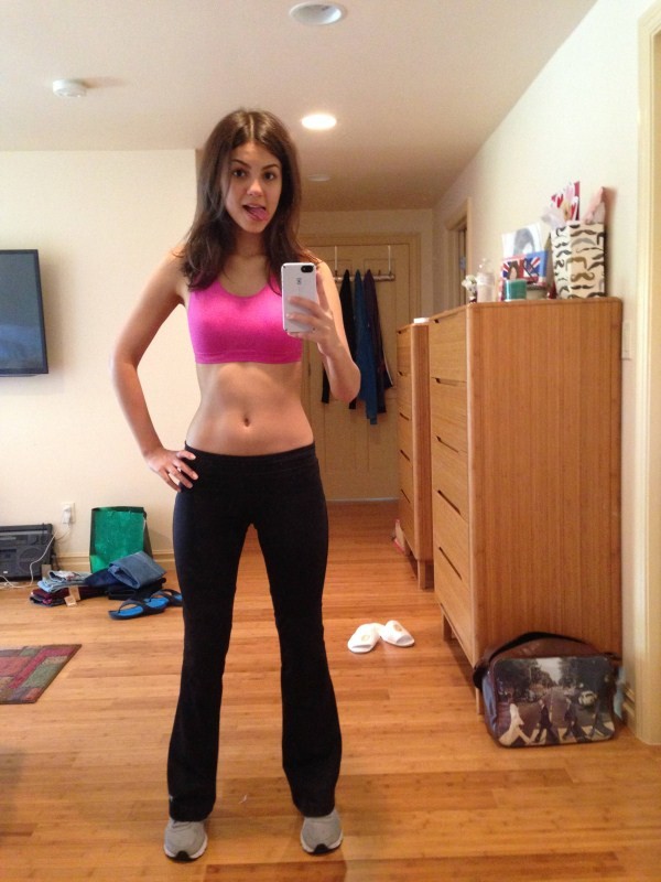victoria justice standing in yoga pants